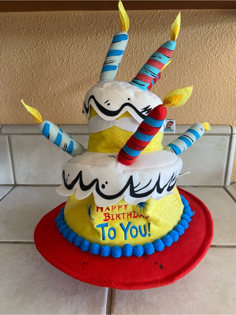 Dr. Seuss Yellow Plush Birthday Cake Hat with Red Brim and Blue Trim